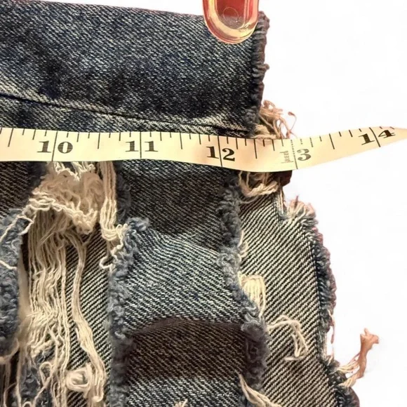 American Eagle denim shorts featuring a distressed look and frayed raw hem - Picture 8 of 8